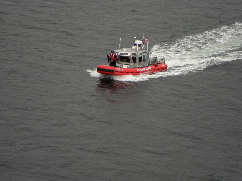 CIMG0774.JPG - That is a machine gun on the front of the Coast Guard boat guarding the cruise ships at dock.